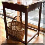 F06. Side table with brass corner braces. 26”h x 18”w 